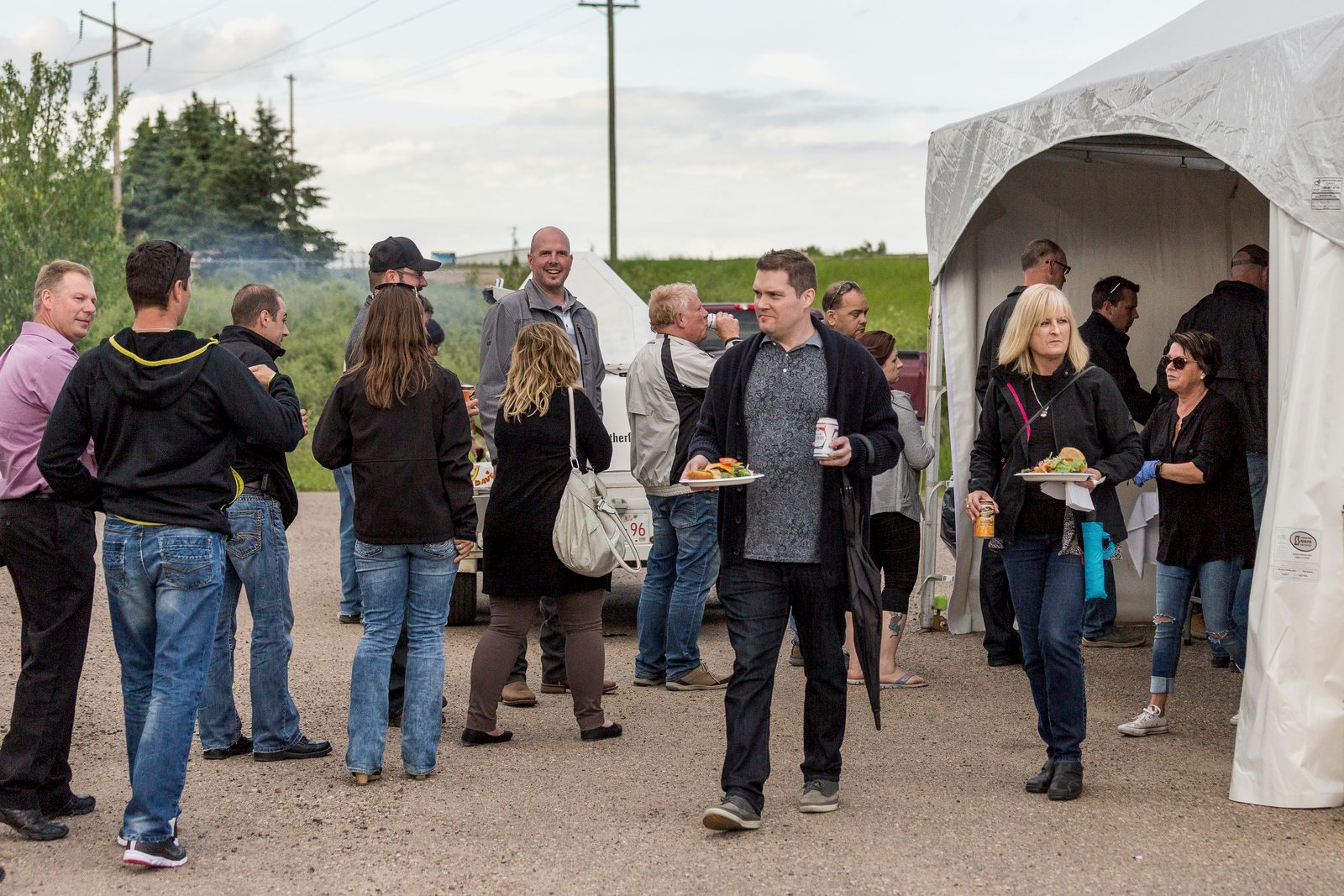 Industry professionals networking at the outdoor BBQ